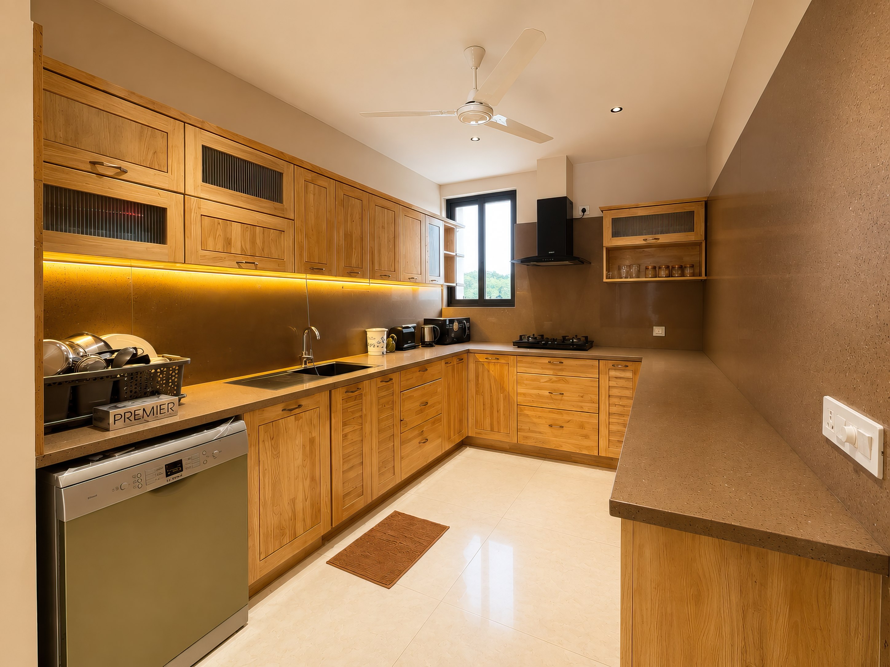 Wooden kitchen with a gas hob, dishwasher, chimney and full run of counter space