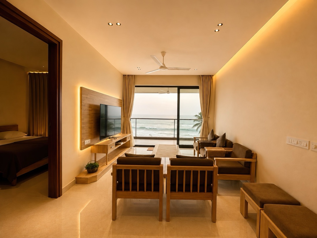 Living room of the 2 BHK, opening through sliding doors to the sea